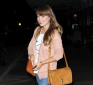 http://celebrity-bags.com/celebrity_bags/olivia-wilde-with-a-casual-gucci-marrakech-handbag