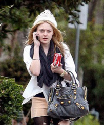 Dakota Fanning Saving Her Outfit With A Balenciaga Handbag